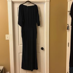 Diane Von Furstenberg navy jumpsuit with pockets and batwing arms. Size 6.